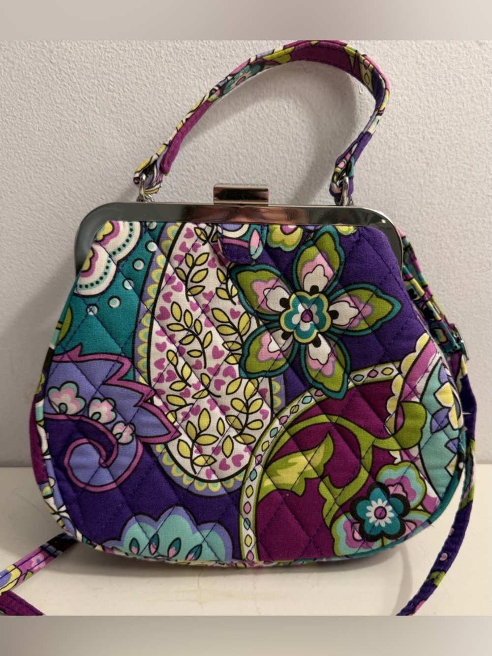 Vera  Bradley mini frame crossbody bag in the Heather pattern.